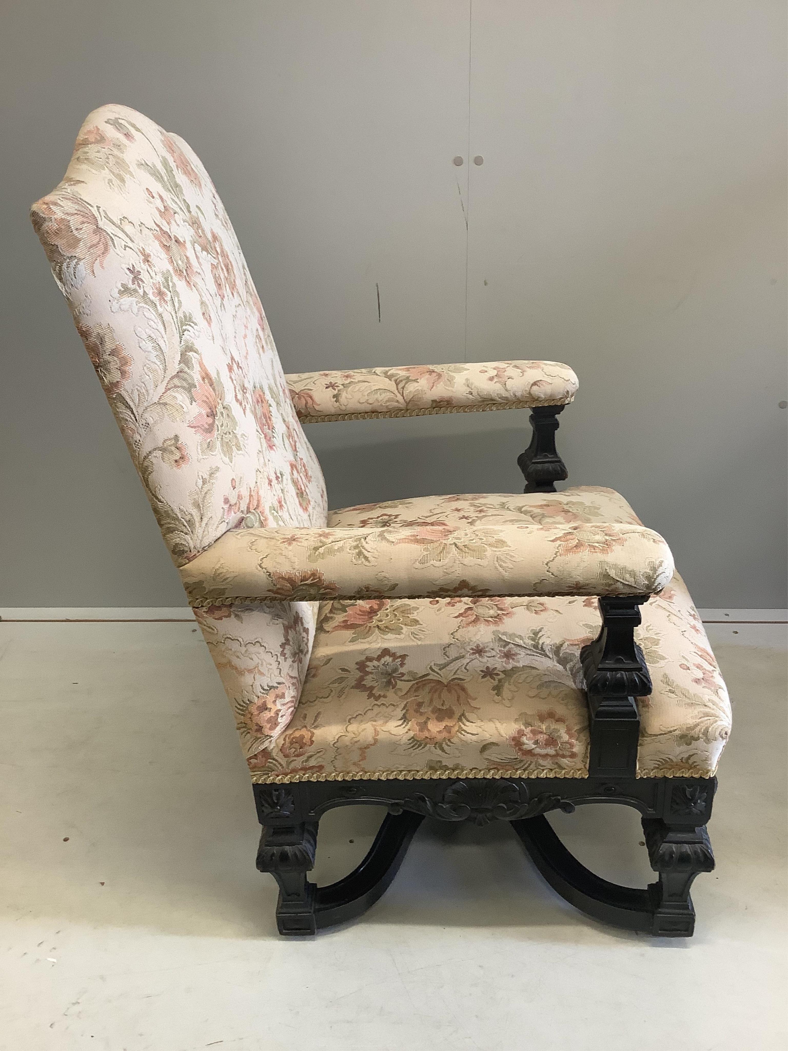 A pair of Louis XIV style ebonised upholstered armchairs, width 65cm, depth 56cm, height 103cm